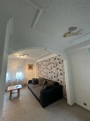 Ein Sitzbereich in der Unterkunft Shekinah Residences near Frankfurt Airport