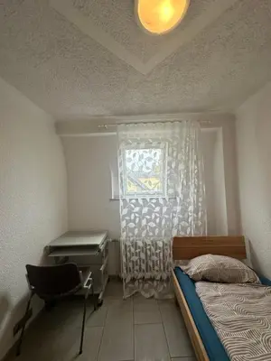 Ein Bett oder Betten in einem Zimmer der Unterkunft Shekinah Residences near Frankfurt Airport