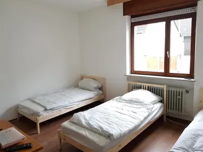 Ein Bett oder Betten in einem Zimmer der Unterkunft Siedlungsstr 19 Bruchsal Whg 10