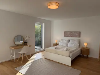 Ein Bett oder Betten in einem Zimmer der Unterkunft Modernes Neubauhaus ca 200 qm Nähe vom Flughafen