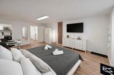 Ein Bett oder Betten in einem Zimmer der Unterkunft WINETIME - Apartment Roschbach - für bis zu 2 Personen - idyllisch an den Weinbergen der südlichen Weinstraße zwischen Landau und Neustadt gelegen