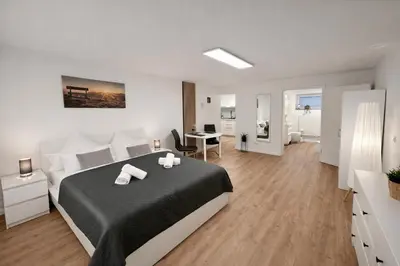 Ein Bett oder Betten in einem Zimmer der Unterkunft WINETIME - Apartment Roschbach - für bis zu 2 Personen - idyllisch an den Weinbergen der südlichen Weinstraße zwischen Landau und Neustadt gelegen