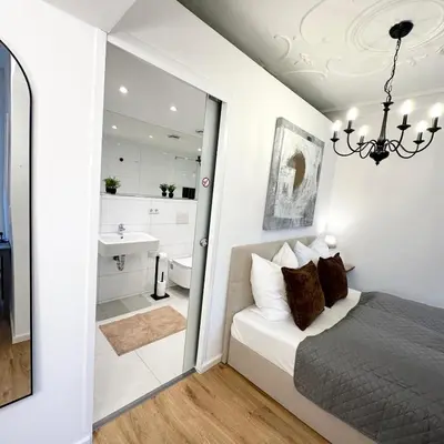 Ein Bett oder Betten in einem Zimmer der Unterkunft BELLA - Business&Family Ap 2, 100m zum Konzerteingang Schloß, Parkplatz, Smart TV, Netflix, Waschmaschine, 24h Checkin, 30 qm
