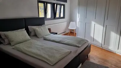 Ein Bett oder Betten in einem Zimmer der Unterkunft Ferienwohnung Luitpold 21