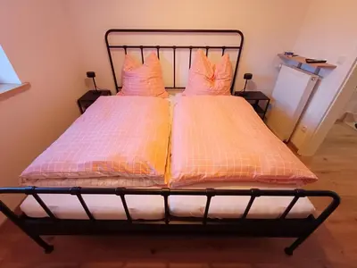 Ein Bett oder Betten in einem Zimmer der Unterkunft Ferienwohnung Beim Schorsch