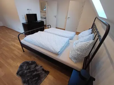 Ein Bett oder Betten in einem Zimmer der Unterkunft Ferienwohnung Beim Schorsch