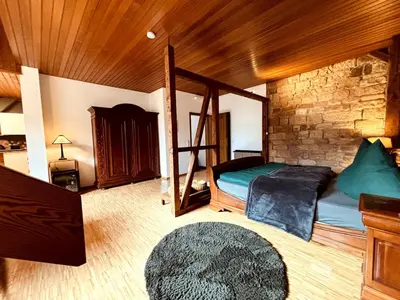 Ein Bett oder Betten in einem Zimmer der Unterkunft Ferienwohnung zum Woibauer