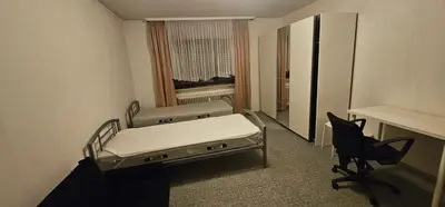 Ein Bett oder Betten in einem Zimmer der Unterkunft Zentralgelegene Wohnung im EG