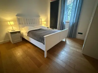 Ein Bett oder Betten in einem Zimmer der Unterkunft Rosenbalkon