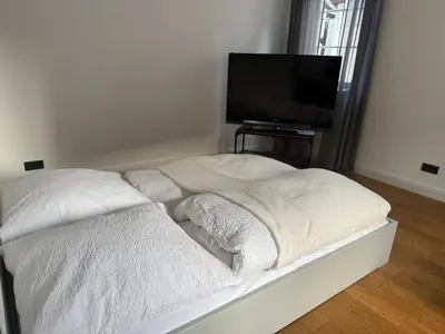 Ein Bett oder Betten in einem Zimmer der Unterkunft Rosenbalkon