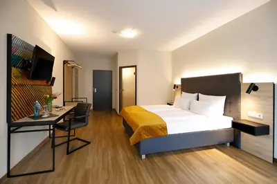 Ein Bett oder Betten in einem Zimmer der Unterkunft Vinotel Dirmstein