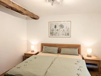 Ein Bett oder Betten in einem Zimmer der Unterkunft Ferienhaus am Gässchen
