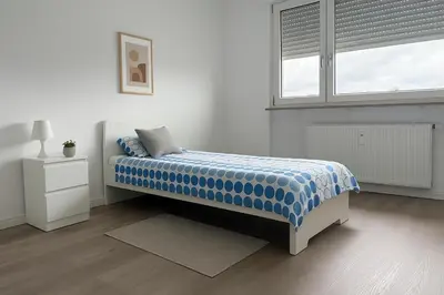 Ein Bett oder Betten in einem Zimmer der Unterkunft Monteur- und Ferienwohnung Viernheim