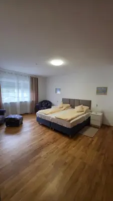 Ein Bett oder Betten in einem Zimmer der Unterkunft ALESIA Ferienwohnung Südpfalz