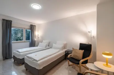 Ein Bett oder Betten in einem Zimmer der Unterkunft 2-Zimmer-Apartment-mit-4-Einzelbetten