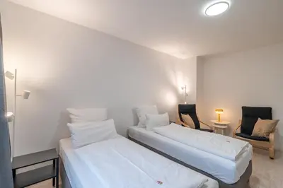 Ein Bett oder Betten in einem Zimmer der Unterkunft 2-Zimmer-Apartment-mit-4-Einzelbetten
