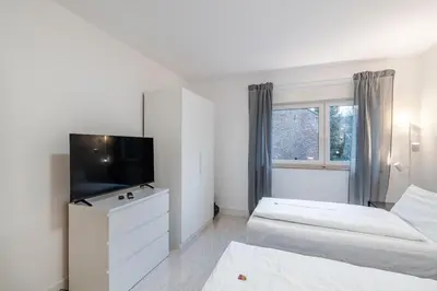 Ein Bett oder Betten in einem Zimmer der Unterkunft 2-Zimmer-Apartment-mit-4-Einzelbetten