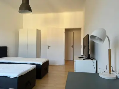 Ein Bett oder Betten in einem Zimmer der Unterkunft 6 Einzelbetten - 4 Zimmer - eigener PARKPLATZ - Balkon