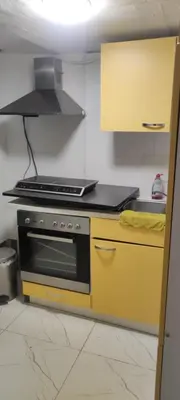 Küche/Küchenzeile in der Unterkunft Einzelne Zimmer mit Gemeinschaft Dusche
