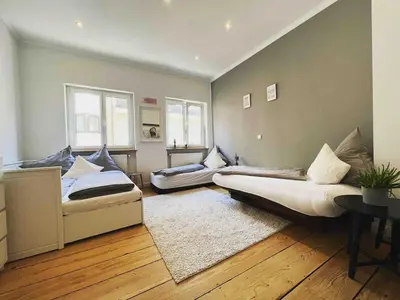 Ein Bett oder Betten in einem Zimmer der Unterkunft Altbauwohnung mit Dachterrasse in der Innenstadt Speyer