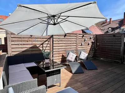 Ein Balkon oder eine Terrasse in der Unterkunft Altbauwohnung mit Dachterrasse in der Innenstadt Speyer