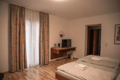 Ein Bett oder Betten in einem Zimmer der Unterkunft Pension Hubertushof