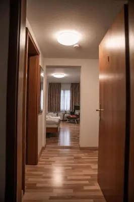 Ein Bett oder Betten in einem Zimmer der Unterkunft Pension Hubertushof