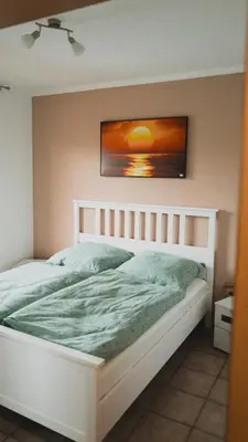 Ein Bett oder Betten in einem Zimmer der Unterkunft Ferienwohnungen Bullau
