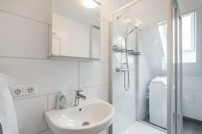 Ein Badezimmer in der Unterkunft 2 Zimmer Dachstudio Apartment mit 4 Einzelbetten