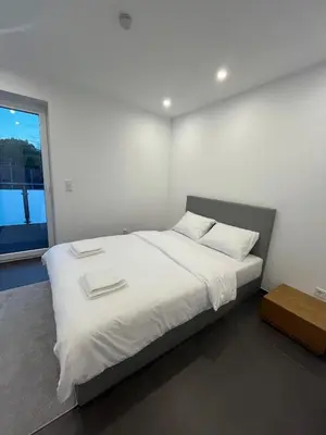 Ein Bett oder Betten in einem Zimmer der Unterkunft Modern new-build apartment