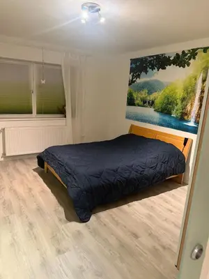 Ein Bett oder Betten in einem Zimmer der Unterkunft liebevoll eingerichtete Ferienwohnung in idyllischer Lage