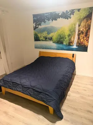 Ein Bett oder Betten in einem Zimmer der Unterkunft liebevoll eingerichtete Ferienwohnung in idyllischer Lage