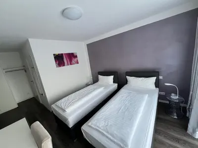 Ein Bett oder Betten in einem Zimmer der Unterkunft Victoria Living
