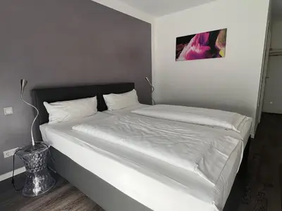 Ein Bett oder Betten in einem Zimmer der Unterkunft Victoria Living