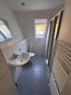 Ein Badezimmer in der Unterkunft Gasthaus & Pension Grüner Baum Eberbach