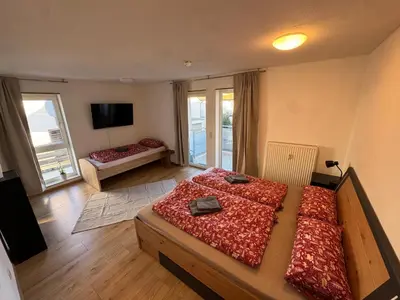 Ein Bett oder Betten in einem Zimmer der Unterkunft City Apart am MUSEUM nahe BADEWELT & Bahnhof