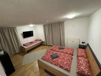 Ein Bett oder Betten in einem Zimmer der Unterkunft City Apart am MUSEUM nahe BADEWELT & Bahnhof