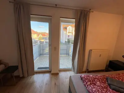 Ein Bett oder Betten in einem Zimmer der Unterkunft City Apart am MUSEUM nahe BADEWELT & Bahnhof