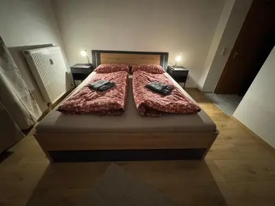 Ein Bett oder Betten in einem Zimmer der Unterkunft City Apart am MUSEUM nahe BADEWELT & Bahnhof