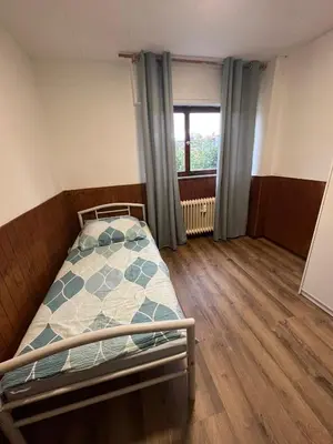 Ein Bett oder Betten in einem Zimmer der Unterkunft Rodgau Work & Sleep