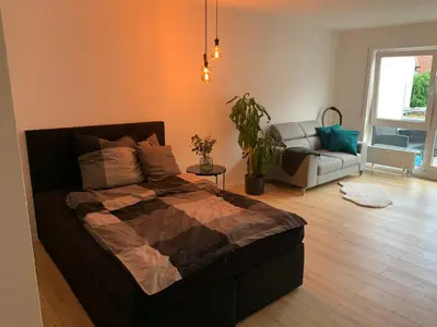 Ein Bett oder Betten in einem Zimmer der Unterkunft Renovated, cozy 1-room apartment with balcony