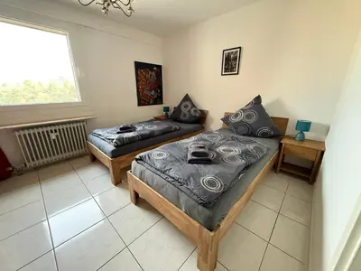 Ein Bett oder Betten in einem Zimmer der Unterkunft Apartment auf dem Betzenberg