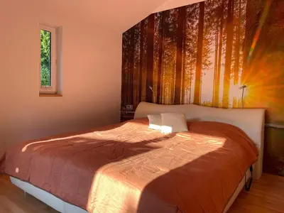 Ein Bett oder Betten in einem Zimmer der Unterkunft Kleine Pfalz im Casa del Cornelia