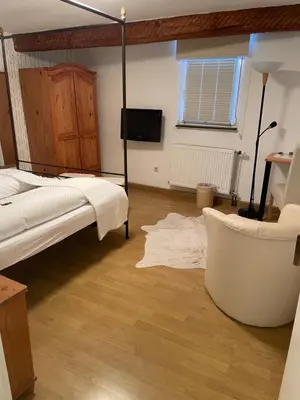 Ein Bett oder Betten in einem Zimmer der Unterkunft Zum Burggraf