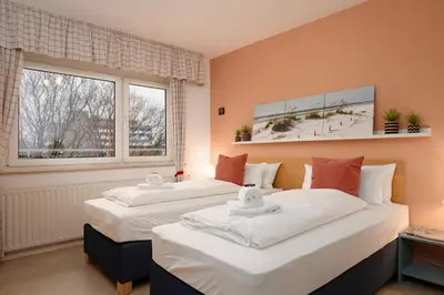 Ein Bett oder Betten in einem Zimmer der Unterkunft Gemütliche 2-Zi-Whg mit Balkon im Süden von HD
