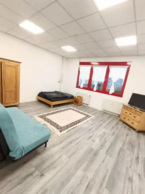 Ein Sitzbereich in der Unterkunft Lumara Apartment Modern temporary living