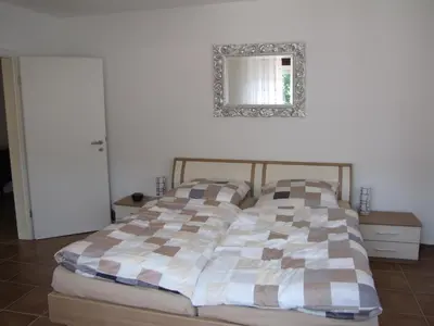 Ein Bett oder Betten in einem Zimmer der Unterkunft Feriendomizil Weinheim