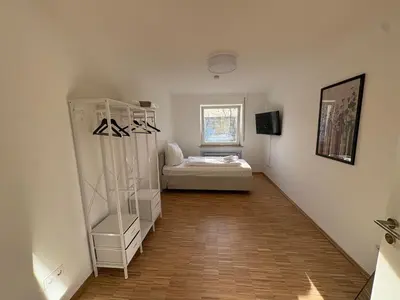 Ein Bett oder Betten in einem Zimmer der Unterkunft Altstadtperle Ettlingen mit Smart TV und WLAN