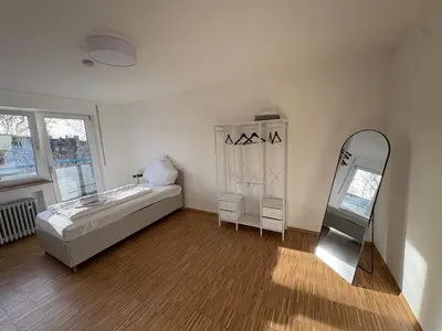 Ein Bett oder Betten in einem Zimmer der Unterkunft Altstadtperle Ettlingen mit Smart TV und WLAN
