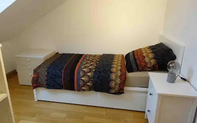 Ein Bett oder Betten in einem Zimmer der Unterkunft Ferienwohnung 